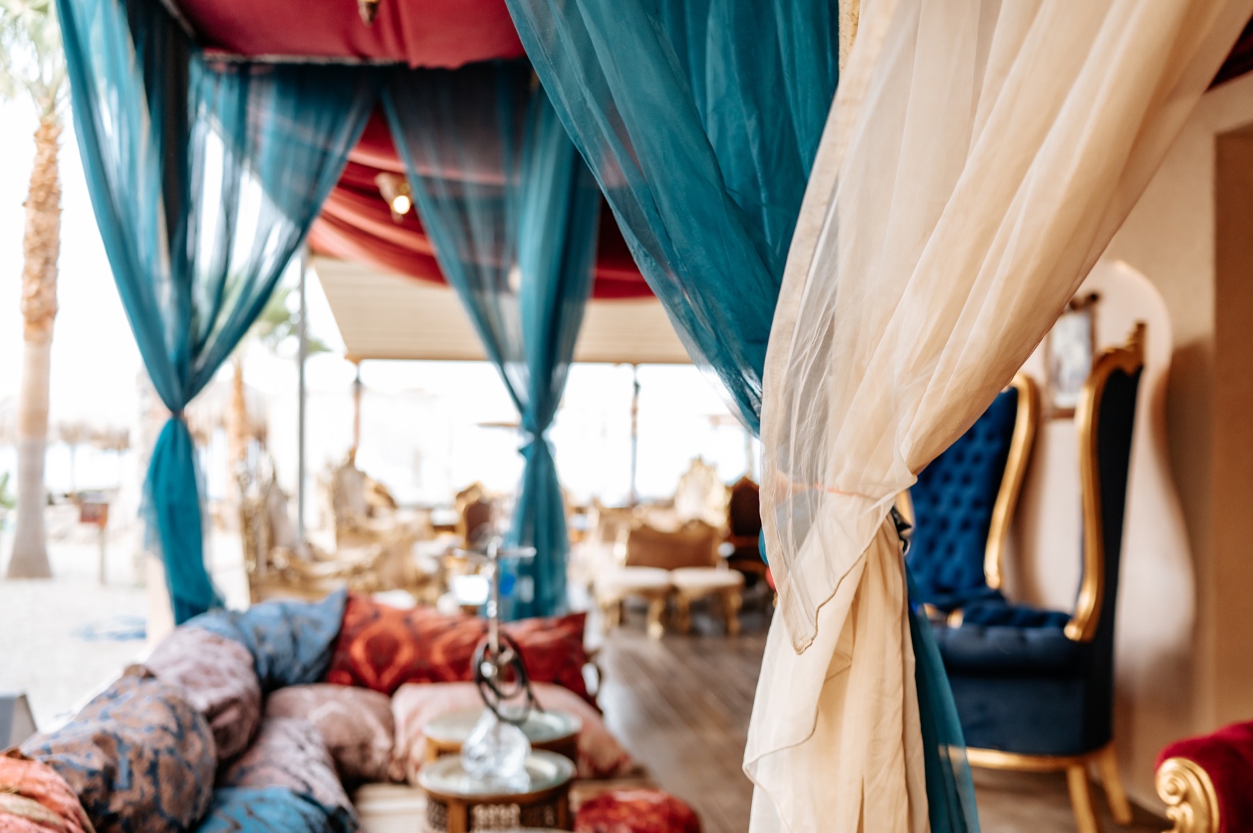 Colourful drapes, patterned cushions and shisha in Harem’s seaside lounge